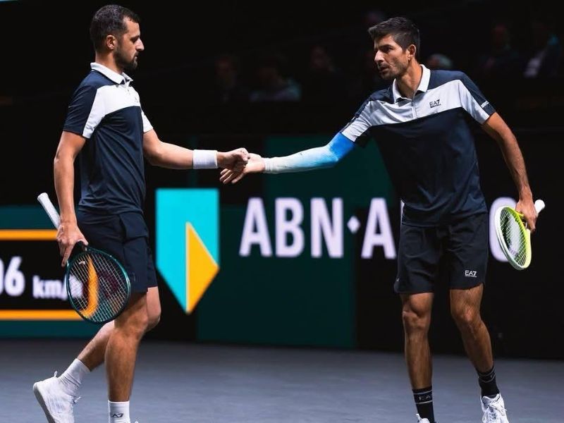 El sonsonateco Chelo Arévalo (d.) saluda a su compañero Mate Pavic, en el torneo de Dubái, Foto: Cortesía Indes